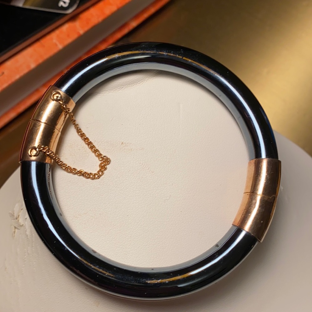 Bangle bracelet with black stone and gold accents